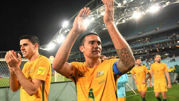Next stop Central America: Australia's Tim Cahill (centre) and Tomas Rogic acknowledge the crowd after their win over Syria at ANZ Stadium. Photo: AAP