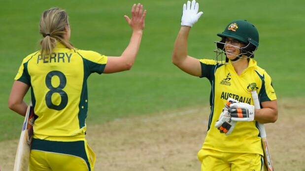 Australia's Ellyse Perry and Nicole Bolton celebrate victory following the ICC Women's World Cup 2017 match between Australia and West Indies at The Cooper Associates County Ground. Photo: Stu Forster/Getty Images
