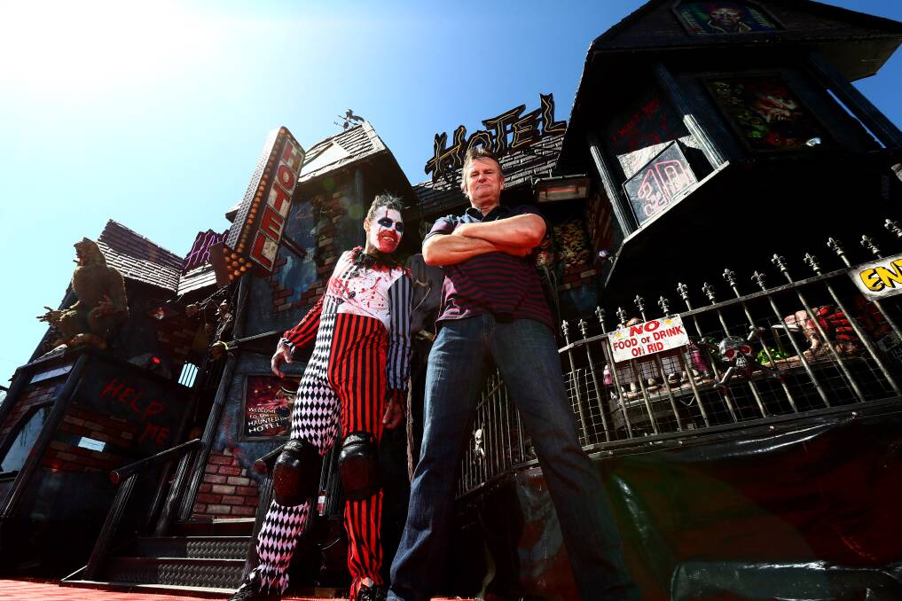 WELCOME: Scary clown Bozo 2.0 and Fearaphobia creator Lewis Osborne stand outside the Haunted Hotel in Clarendon. Picture: Geoff Jones