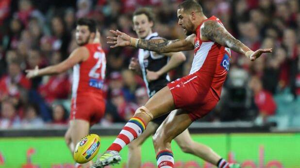 Milestone night: Buddy Franklin takes a shot at goal. Photo: AAP