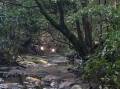 Motorcycles photographed crossing Camp Gully Creek in August 2022, during a previous hike. Picture supplied