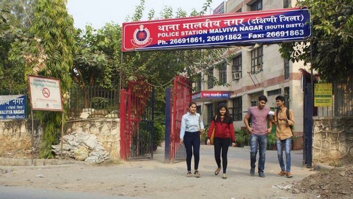 A group of young men and women leave a police station in South Delhi. Photo: Alys Francis