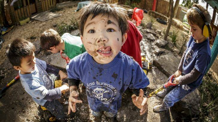 Kinder kids playing in the mud play area at East Burwood Preschool. Photo: Daniel Pockett