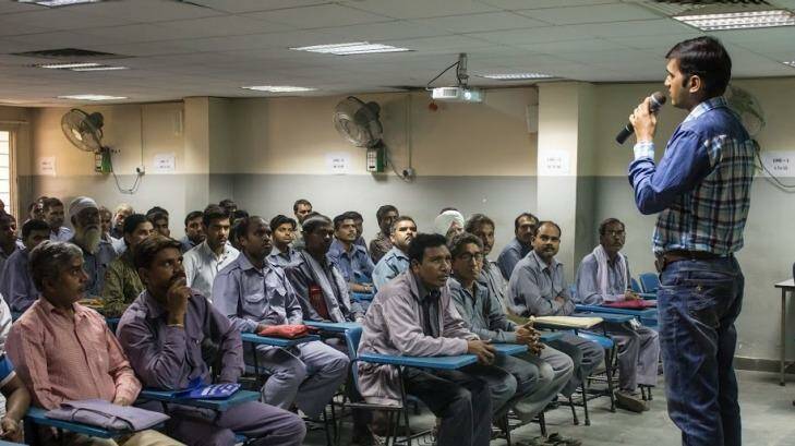 Auto-rickshaw drivers listen during a gender training session at Ashok Leyland Driver Training Institute in north Delhi. Photo: Alys Francis