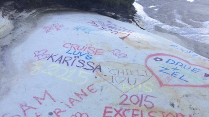 Visitors have been making their mark by chalking names on the rock in bright colours. Photo: Nick Galvin