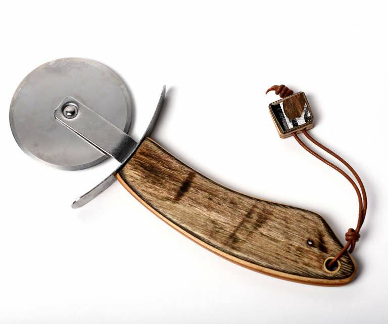 Carving it up: Skater and designer Rowland Perry refashions old skateboards into bespoke kitchen tools, like this pizza cutter. $90. skateshank.com