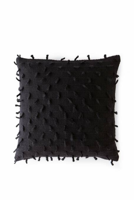 Petje cushion, black, $79.95, 50cm x 50cm, countryroad.com.au. Photo: Supplied