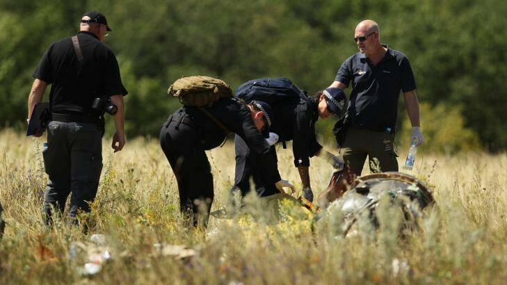 Australian Federal Police searching at the MH17 crash site for human remains. Photo: Kate Geraghty