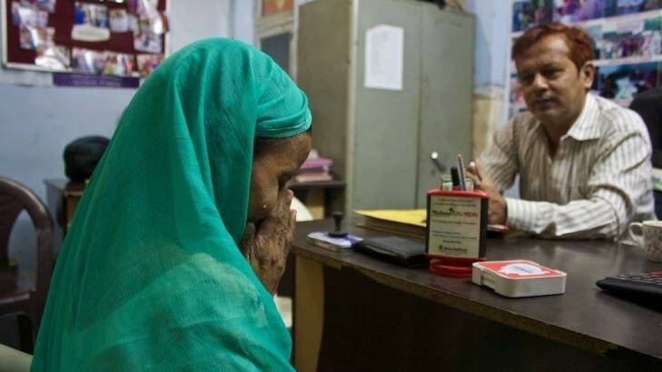 Harpyari speaks to counsellor Nadeem Ahmed in a women's crisis centre in north-west Delhi. Photo: Alys Francis