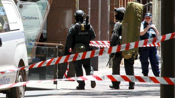 Snipers enter Martin Place from Macquarie Street as the siege unfolded. Photo: Edwina Pickles