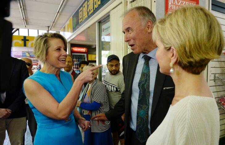 Kristina Keneally snuck up on John Alexander while he was campaigning in Eastwood Mall with Julie Bishop. Pic Nick Moir