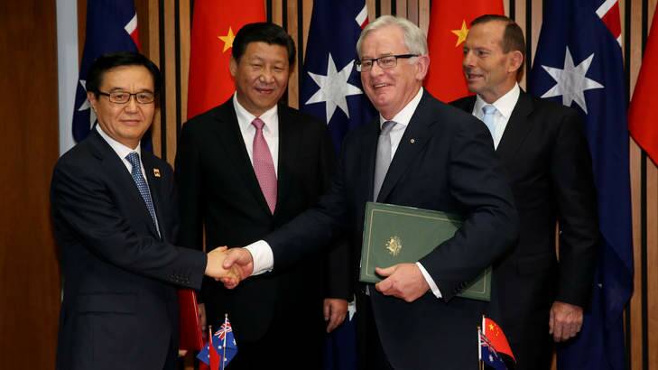 New era in China trade: (From left) Chinese Commerce Minister Gao Hucheng, Chinese President Xi Jinping, Trade Minister Andrew Robb and Prime Minister Tony Abbott. Photo: Kym Smith