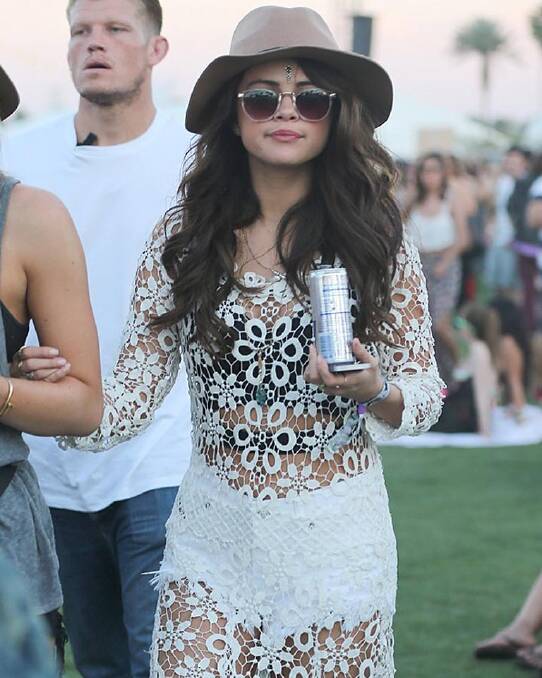 Selena Gomez wears a see-through lace dress on day one of the Coachella festival. Photo: FAMEFLYNET