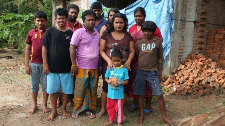 Uncertain future ... the repatriated Sri Lankan asylum seekers -  Hemantha Kuruppu (third from left), Janaka Gayan Athukorala (forth from left), and Sujeewa Saparamadu (second from right) - and their families. Photo: Jason Koutsoukis