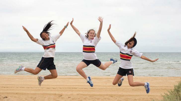 Senior school students celebrate their efforts during a house cross-country event. Photo: Michelle Dennis
