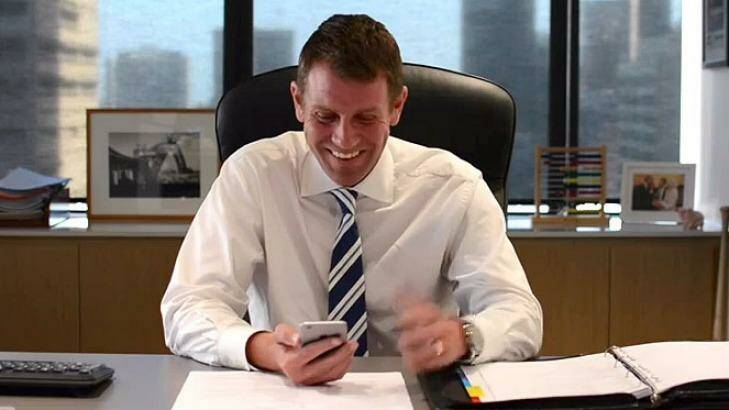 "That's actually quite clever": Mike Baird has a chuckle at one of the tweets in a still from the video. Photo: YouTube