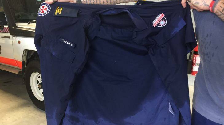 A paramedic over shirt soaked with sweat. Photo: HSU