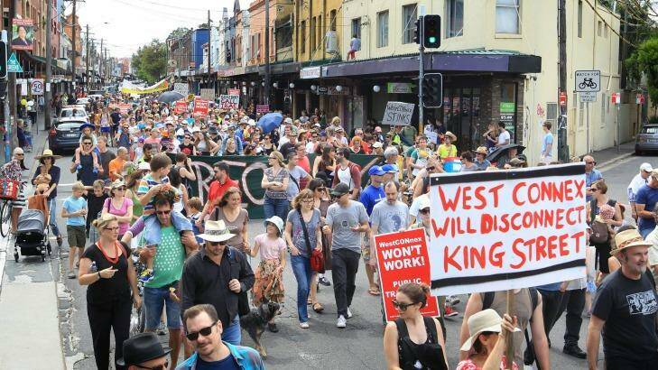 Concerned residents take to the streets of Newtown, Sydney, to protest the proposed development of the NSW government's WestConnex tunnel and road project. Photo: James Alcock
