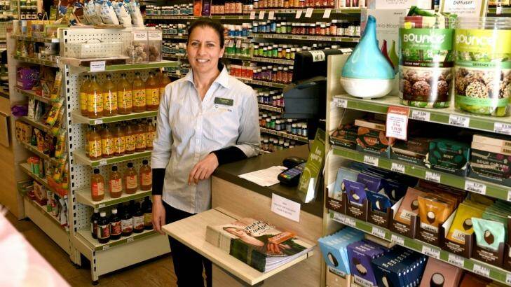 Shop assistant Carina Angelo works in a health food store that has replaced a takeaway joint in Kings Cross. Photo: Steven Siewert
