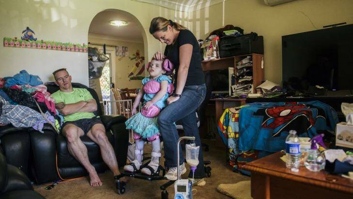 Trevor and Cherie Dell with 3-year-old daughter Abbey who suffers a rare genetic disorder, CDKL5. Photo: Rohan Thomson