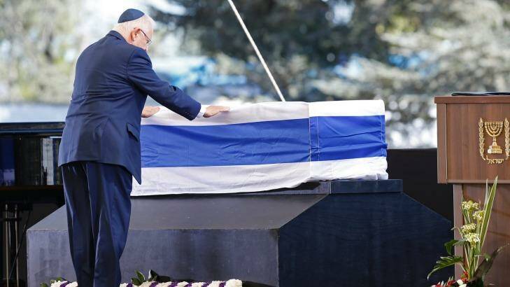Israel's President Reuven Rivlin pays his respects. Photo: ARIEL SCHALIT