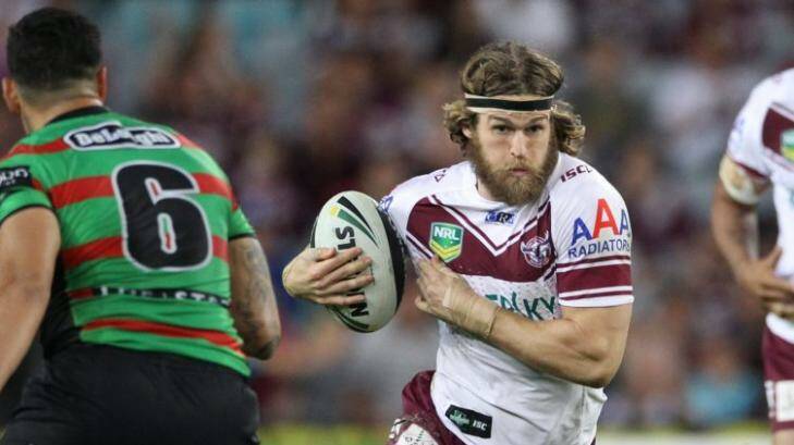 Manly's David Williams (right) has been banned for betting on NRL matches. Photo: Anthony Johnson