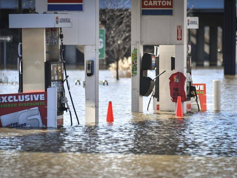 Storms reaching across the Mississippi Valley into Ohio have killed a woman and brought flooding.