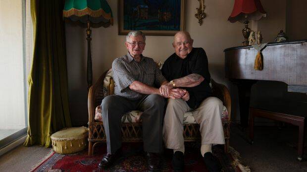 Ian Fenwicke, 74, with his partner Neville Wills, 98, in their Greenwich home. Photo: Louise Kennerley