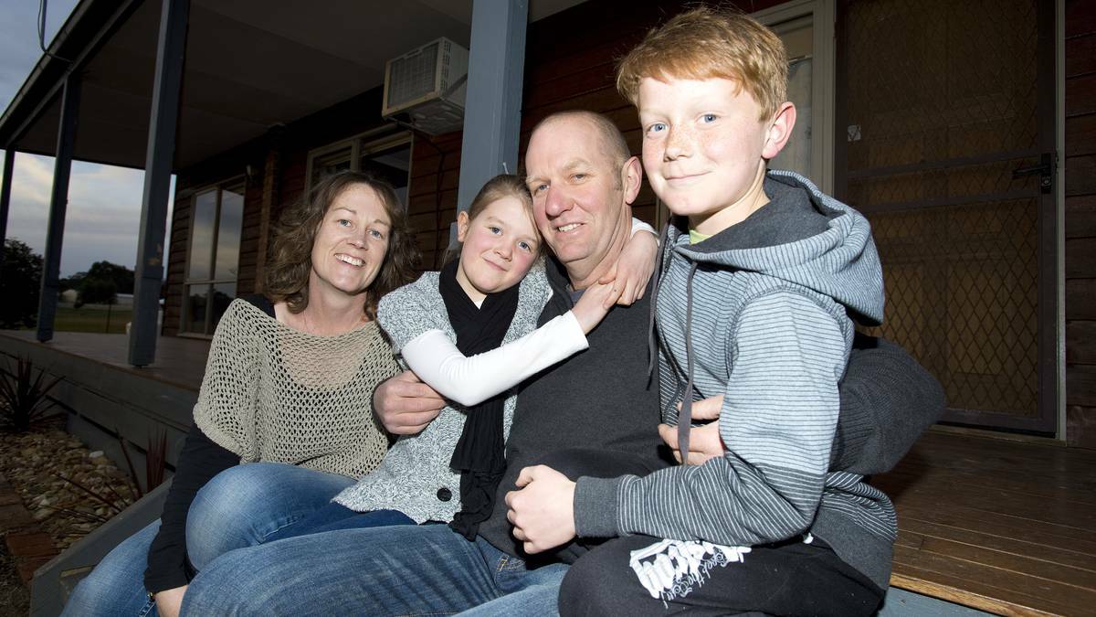 Wayne Pritchard with his wife Belinda and children Megan and Patrick at their Daisy Hill home. Pic: Shane Goss/ The Licoricve Gallery
