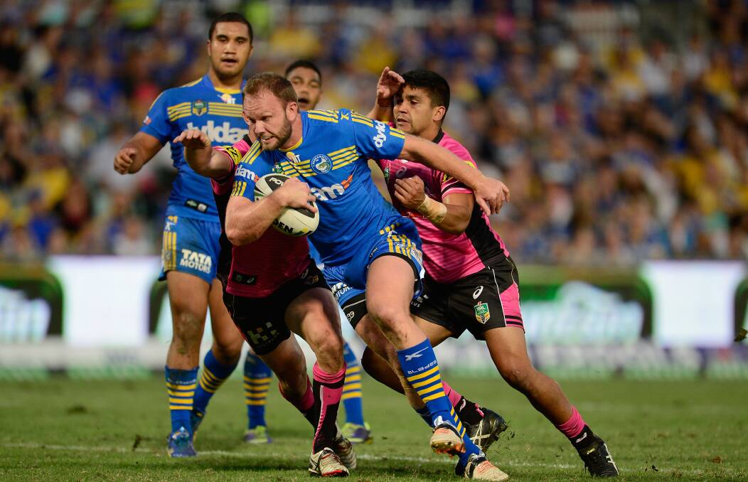SYDNEY, AUSTRALIA - MARCH 29: David Gower of the Eels breaks free from a tackle during the round four NRL match between the Parramatta Eels and the Penrith Panthers at Pirtek Stadium on March 29, 2014 in Sydney, Australia. (Photo by Brett Hemmings/Getty Images)