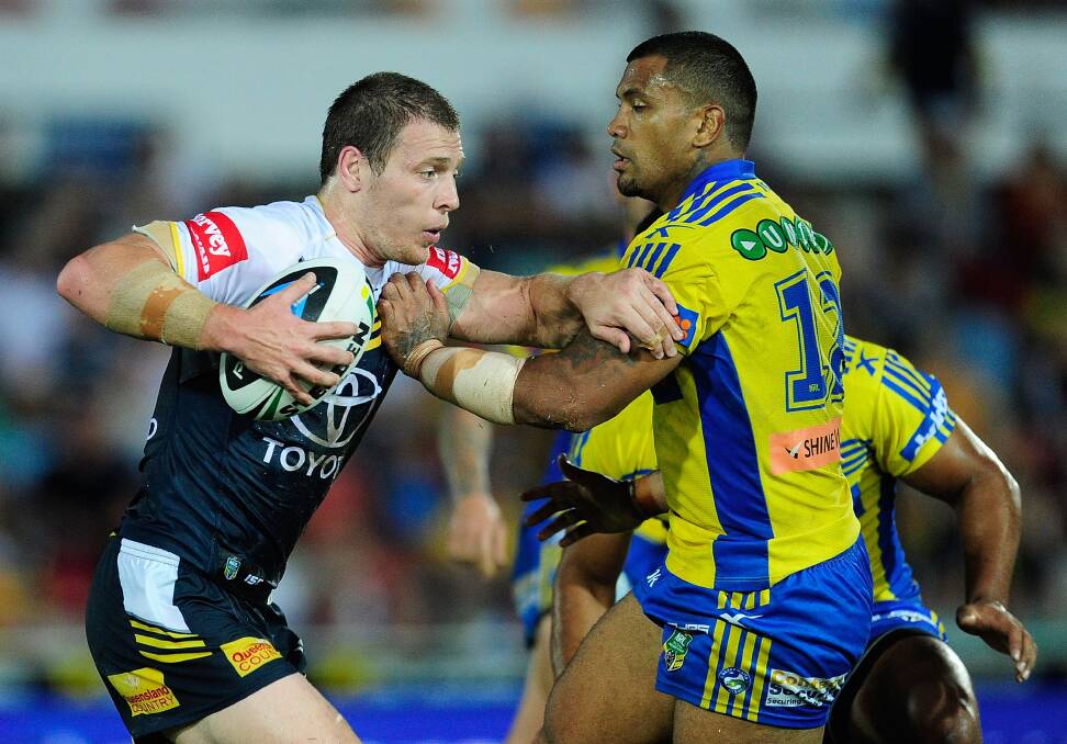 TOWNSVILLE, AUSTRALIA - APRIL 26: Rory Kostjasyn of the Cowboys attempts to get past Manu Ma'u of the Eels during the round 8 NRL match between the North Queensland Cowboys and the Parramatta Eels at 1300SMILES Stadium on April 26, 2014 in Townsville, Australia. (Photo by Ian Hitchcock/Getty Images)