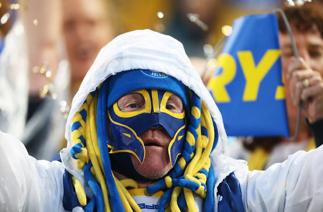 SYDNEY, AUSTRALIA - APRIL 12: An Eels fan celebrates a try during the round 6 NRL match between the Parramatta Eels and the Sydney Roosters at Pirtek Stadium on April 12, 2014 in Sydney, Australia. (Photo by Mark Metcalfe/Getty Images)
