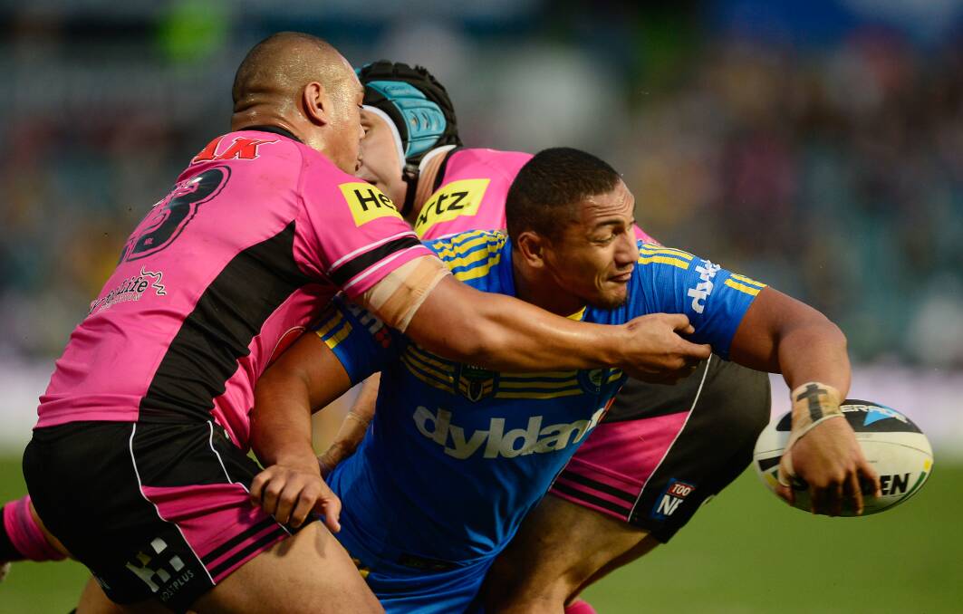 SYDNEY, AUSTRALIA - MARCH 29: Pauli Pauli of the Eels looks to off load the ball during the round four NRL match between the Parramatta Eels and the Penrith Panthers at Pirtek Stadium on March 29, 2014 in Sydney, Australia. (Photo by Brett Hemmings/Getty Images)