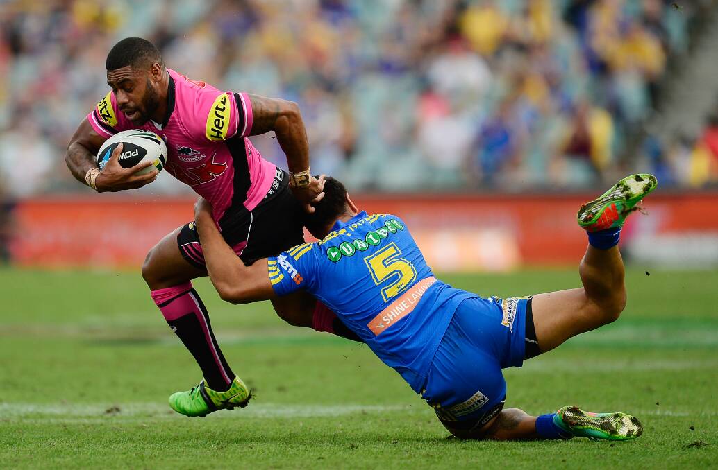 SYDNEY, AUSTRALIA - MARCH 29: Kevin Naiqama of the Panthers is tackled by Ken Sio of the Eels during the round four NRL match between the Parramatta Eels and the Penrith Panthers at Pirtek Stadium on March 29, 2014 in Sydney, Australia. (Photo by Brett Hemmings/Getty Images)