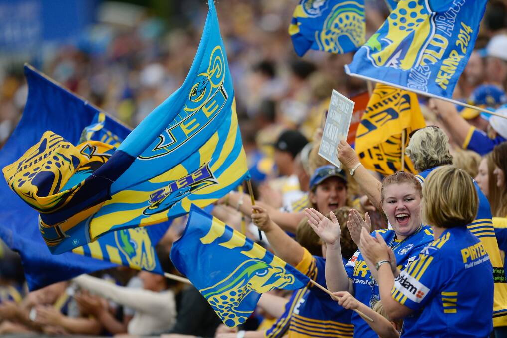 SYDNEY, AUSTRALIA - MARCH 29: Eels fans celebrate after a try during the round four NRL match between the Parramatta Eels and the Penrith Panthers at Pirtek Stadium on March 29, 2014 in Sydney, Australia. (Photo by Brett Hemmings/Getty Images)