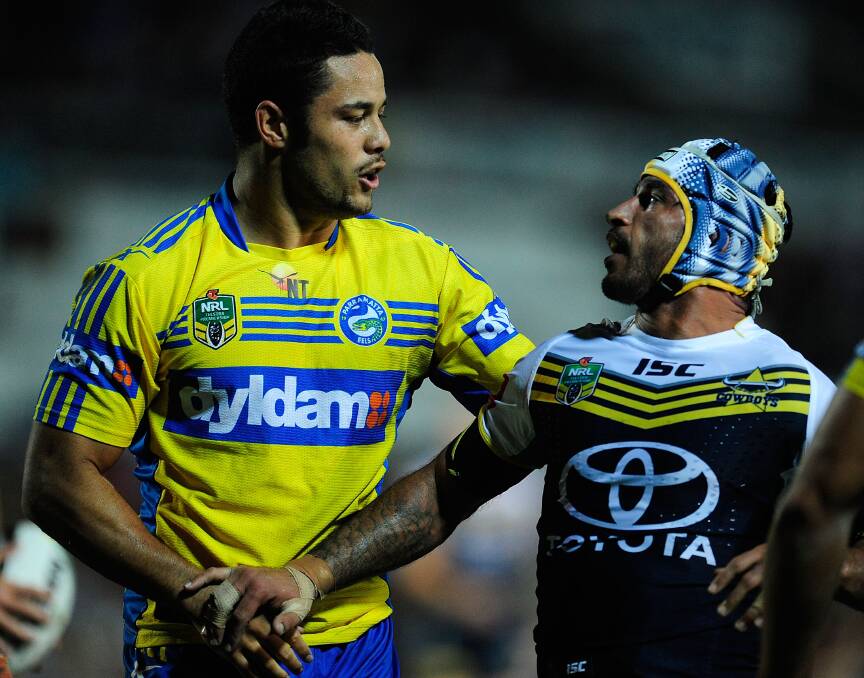 TOWNSVILLE, AUSTRALIA - APRIL 26: Jarryd Hayne of the Eels tussles with Johnathan Thurston of the Cowboys during the round 8 NRL match between the North Queensland Cowboys and the Parramatta Eels at 1300SMILES Stadium on April 26, 2014 in Townsville, Australia. (Photo by Ian Hitchcock/Getty Images)