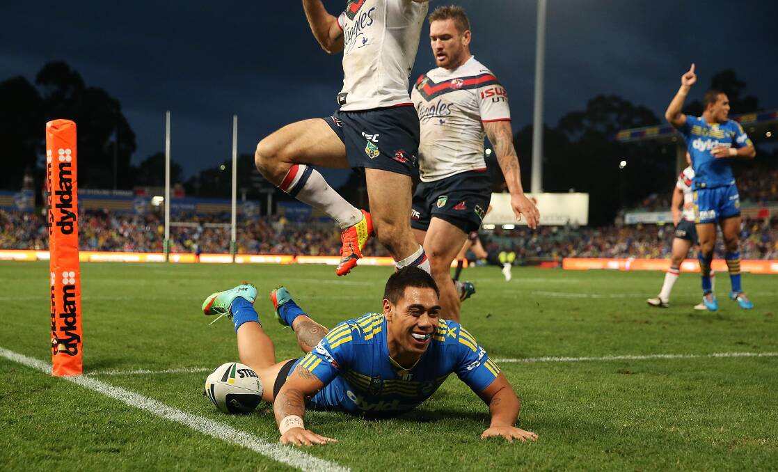 SYDNEY, AUSTRALIA - APRIL 12: Ken Sio of the Eels scores a try during the round 6 NRL match between the Parramatta Eels and the Sydney Roosters at Pirtek Stadium on April 12, 2014 in Sydney, Australia. (Photo by Mark Metcalfe/Getty Images)