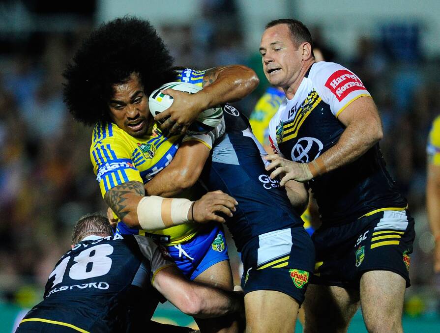 TOWNSVILLE, AUSTRALIA - APRIL 26: Fuifui Moimoi of the Eels is wrapped up by the Cowboys defence during the round 8 NRL match between the North Queensland Cowboys and the Parramatta Eels at 1300SMILES Stadium on April 26, 2014 in Townsville, Australia. (Photo by Ian Hitchcock/Getty Images)