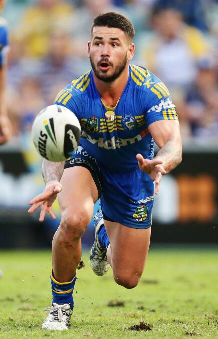 SYDNEY, AUSTRALIA - MARCH 29: Nathan Peats of the Eels passes during the round four NRL match between the Parramatta Eels and the Penrith Panthers at Pirtek Stadium on March 29, 2014 in Sydney, Australia. (Photo by Matt King/Getty Images)