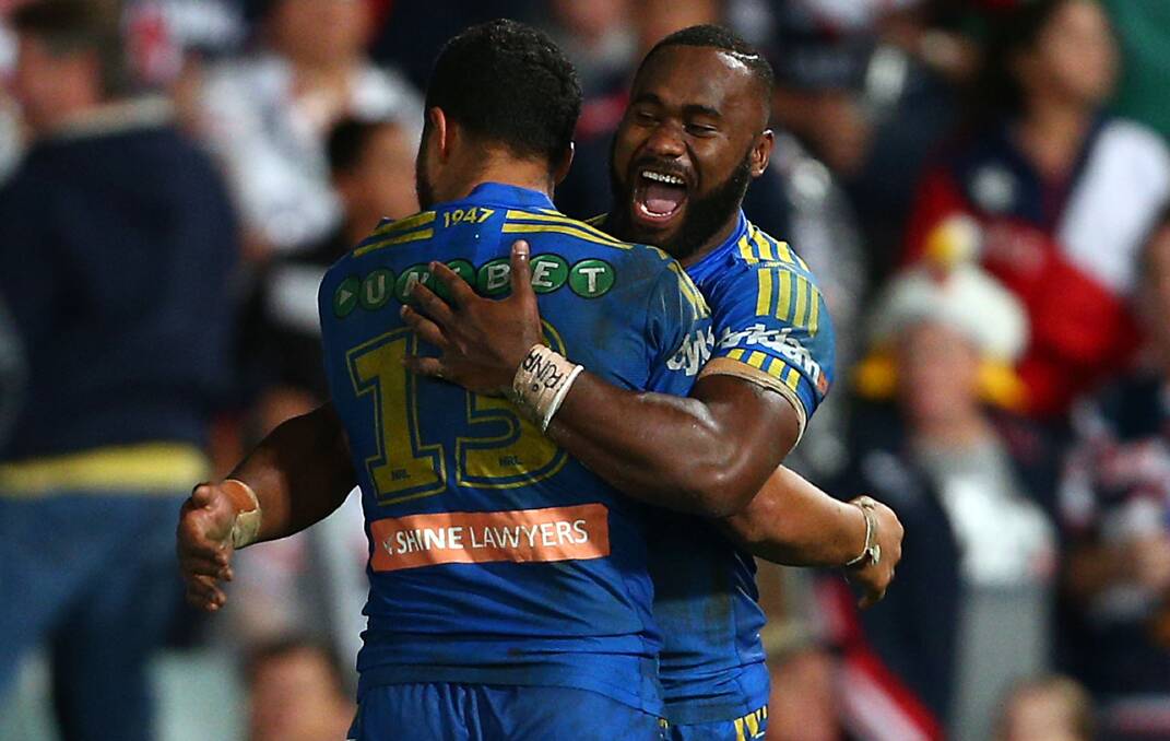 SYDNEY, AUSTRALIA - APRIL 12: Semi Radradra of the Eels celebrates his teams win with Joseph Paulo during the round 6 NRL match between the Parramatta Eels and the Sydney Roosters at Pirtek Stadium on April 12, 2014 in Sydney, Australia. (Photo by Renee McKay/Getty Images)