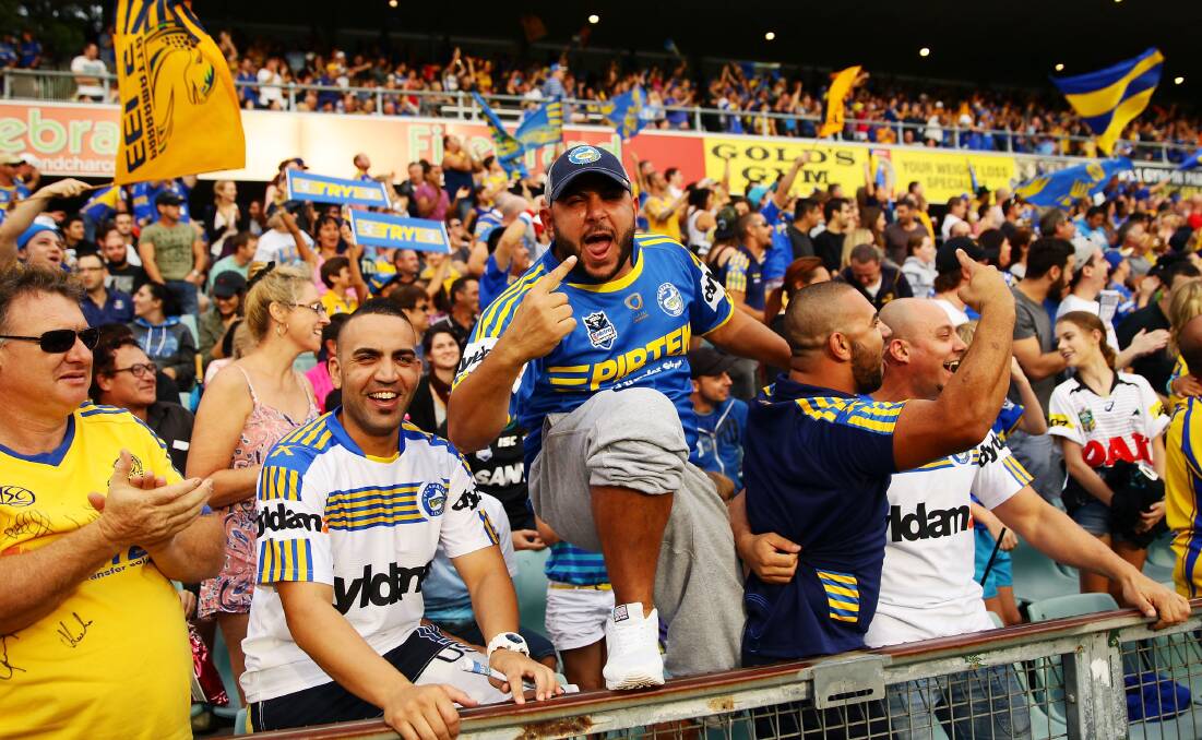 SYDNEY, AUSTRALIA - MARCH 29: Eels fans celebrate a try during the round four NRL match between the Parramatta Eels and the Penrith Panthers at Pirtek Stadium on March 29, 2014 in Sydney, Australia. (Photo by Matt King/Getty Images)