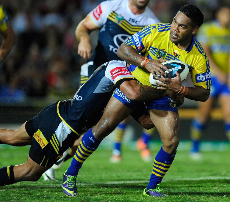 TOWNSVILLE, AUSTRALIA - APRIL 26: Chris Sandow of the Eels is tackled by Johnathan Thurston of the Cowboys during the round 8 NRL match between the North Queensland Cowboys and the Parramatta Eels at 1300SMILES Stadium on April 26, 2014 in Townsville, Australia. (Photo by Ian Hitchcock/Getty Images)