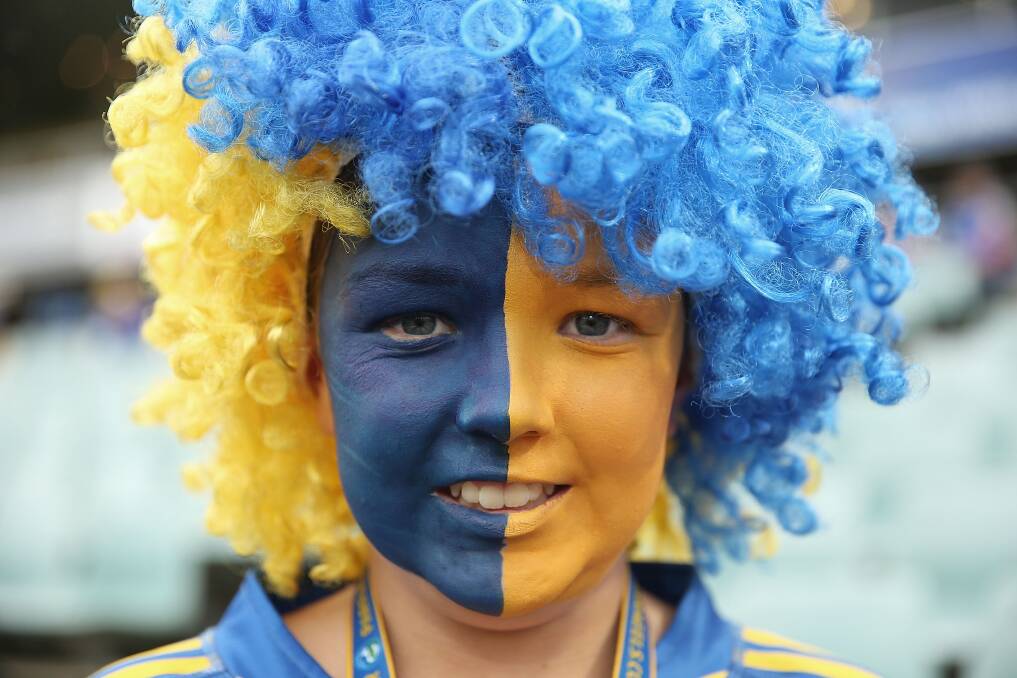 SYDNEY, AUSTRALIA - APRIL 12: A young Eels fan poses during the round 6 NRL match between the Parramatta Eels and the Sydney Roosters at Pirtek Stadium on April 12, 2014 in Sydney, Australia. (Photo by Mark Metcalfe/Getty Images)