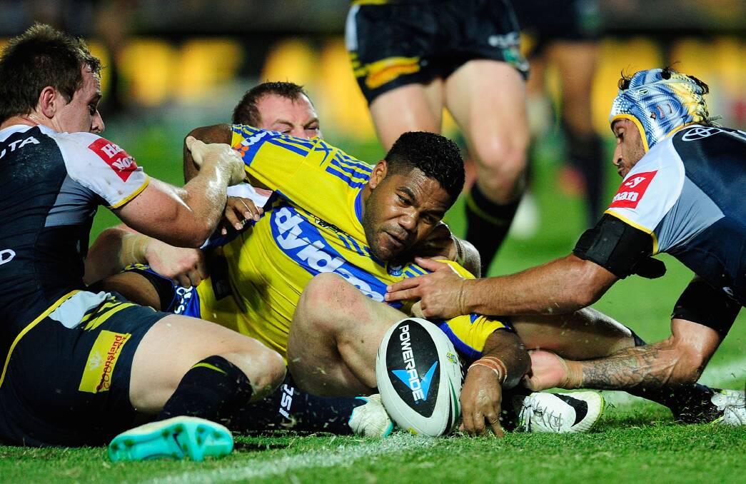TOWNSVILLE, AUSTRALIA - APRIL 26: Chris Sandow of the Eels unsuccessfully attempts to score a try during the round 8 NRL match between the North Queensland Cowboys and the Parramatta Eels at 1300SMILES Stadium on April 26, 2014 in Townsville, Australia. (Photo by Ian Hitchcock/Getty Images)
