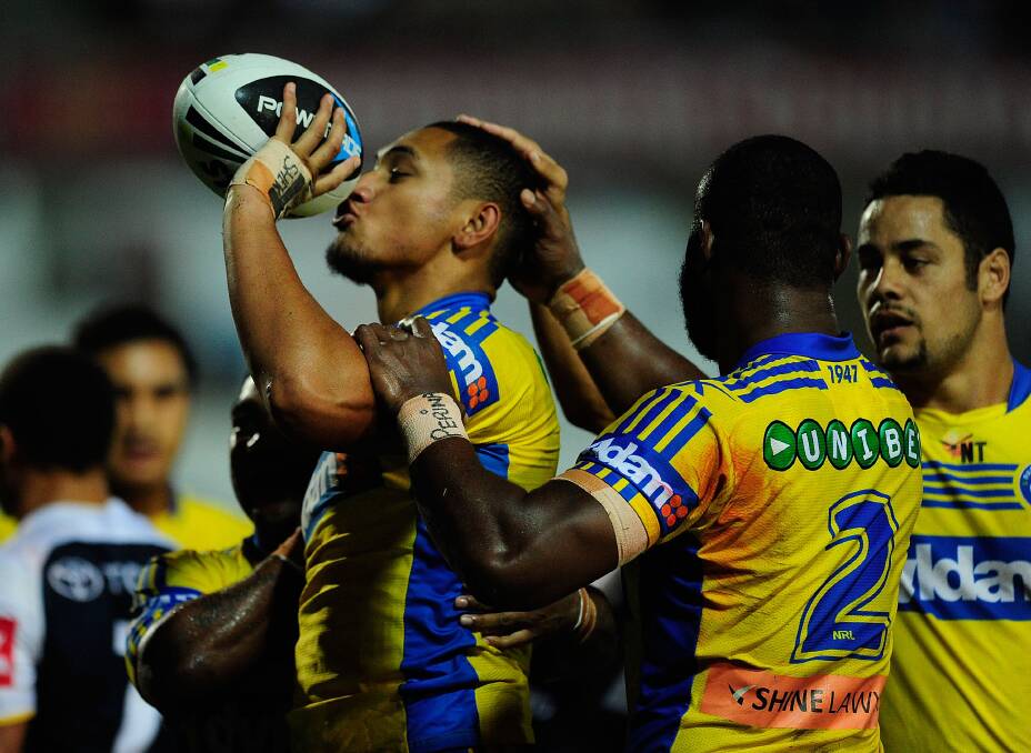 TOWNSVILLE, AUSTRALIA - APRIL 26: Pauli Pauli of the Eels celebrates after scoring a try during the round 8 NRL match between the North Queensland Cowboys and the Parramatta Eels at 1300SMILES Stadium on April 26, 2014 in Townsville, Australia. (Photo by Ian Hitchcock/Getty Images)