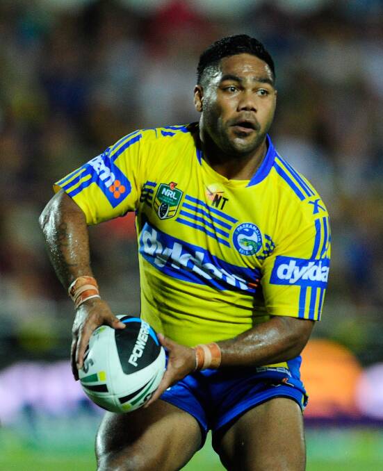TOWNSVILLE, AUSTRALIA - APRIL 26: Chris Sandow of the Eels looks to pass the ball during the round 8 NRL match between the North Queensland Cowboys and the Parramatta Eels at 1300SMILES Stadium on April 26, 2014 in Townsville, Australia. (Photo by Ian Hitchcock/Getty Images)