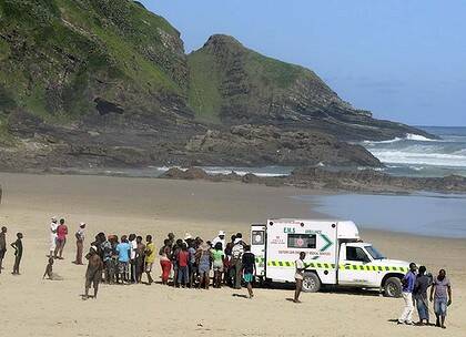 Another death...paramedics attempt to save the latest Second beach shark victim last Sunday.