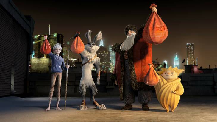 Jack Frost (Chris Pine), Bunnymund (Hugh Jackman), North (Alec Baldwin) and Sandman show off their holiday loot in DreamWorks' Rise of teh Guardians.