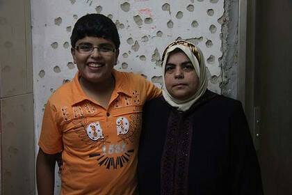 "Justice has been done" ...  Majed Rabah with his mother, Afaf. There were  150 complaints about soldiers' behaviour during the war.