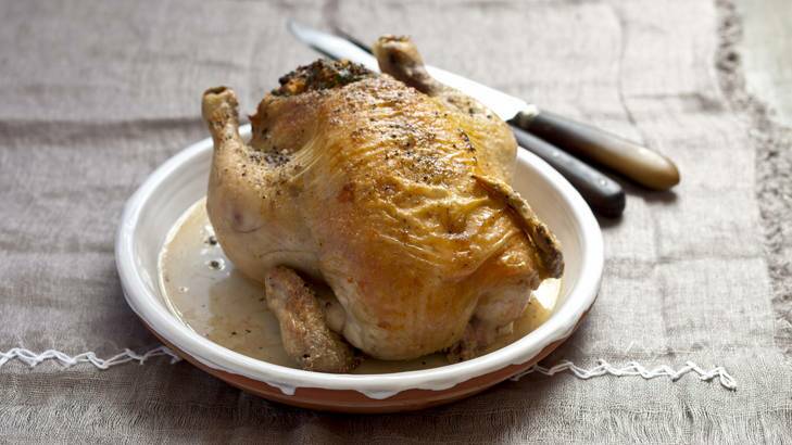 Homely pleasure ... Karen Martini's roast chicken stuffed with light rye, bacon and parmesan.